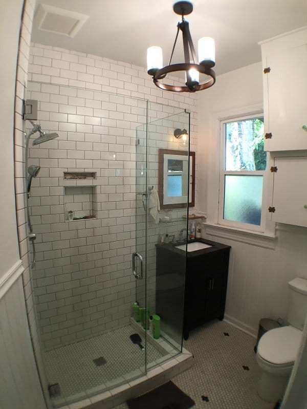 All-white bathroom with a white marble bricked shower
