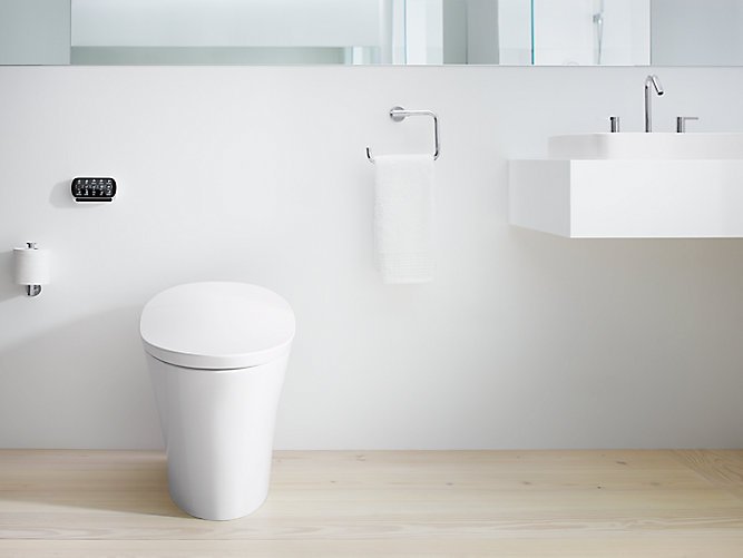 A sleek, modern toilet set again a white bathroom wall 