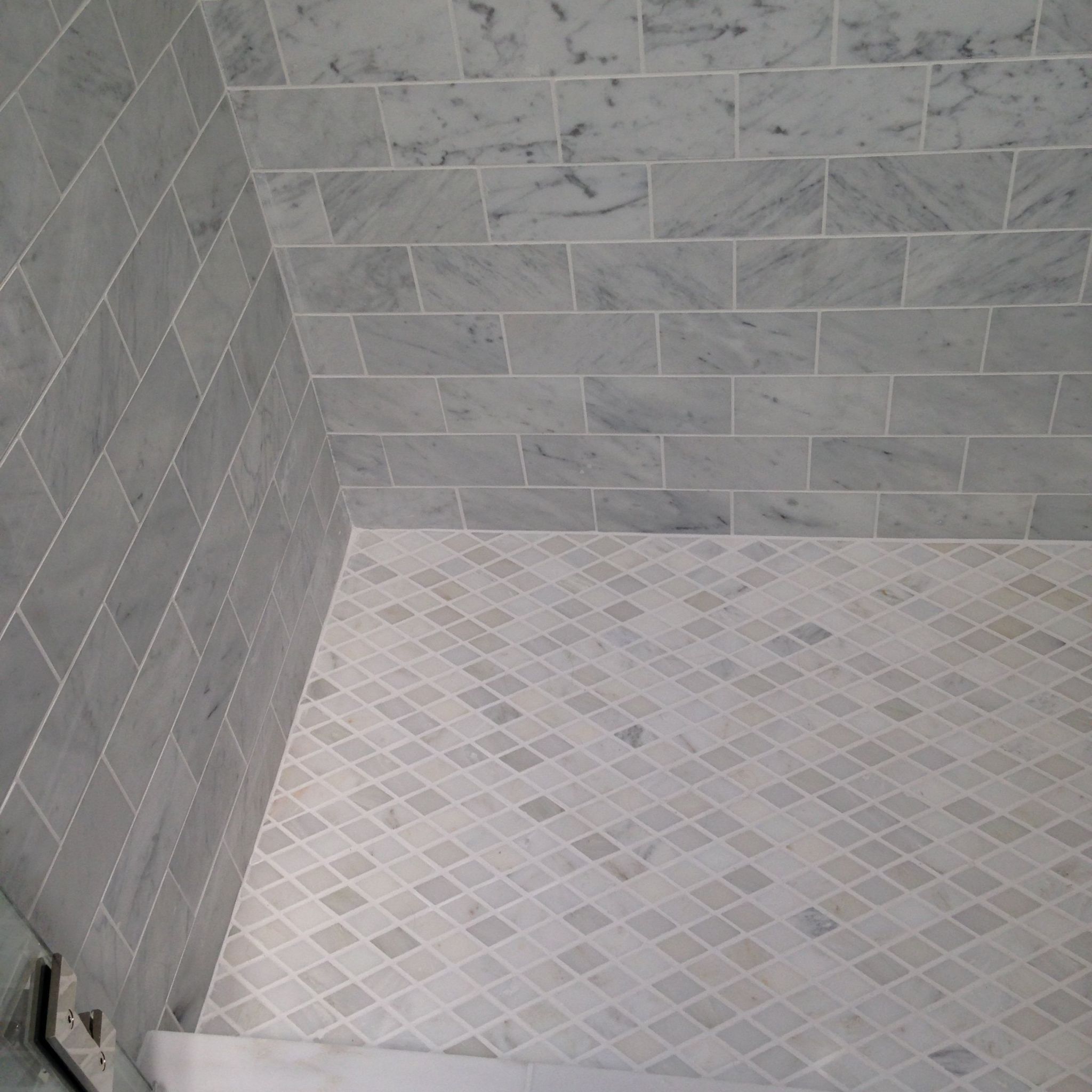Grey marble tile in brick and checkered patterns