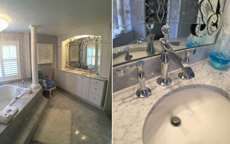 Bathroom where floor carpet was replaced with white marble and a marble vanity