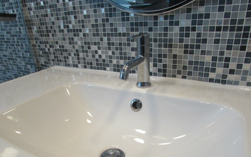 A bathroom faucet with a single hole, single handle faucet
