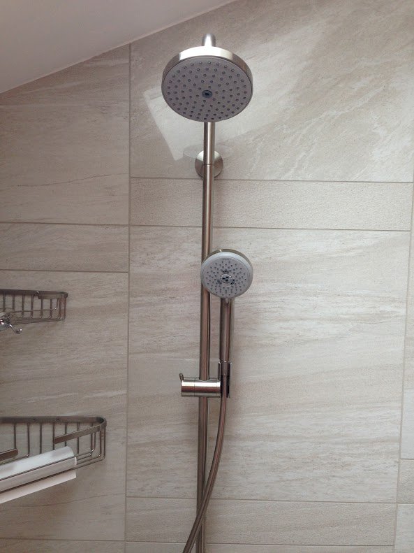 Dual, brushed nickel shower head with fixed head and removable attachment
