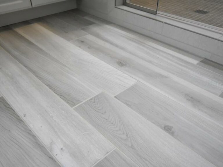 Grey luxury vinyl tile with woodgrain look