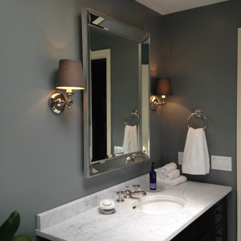 Bathroom vanity with quartz countertops and mirror